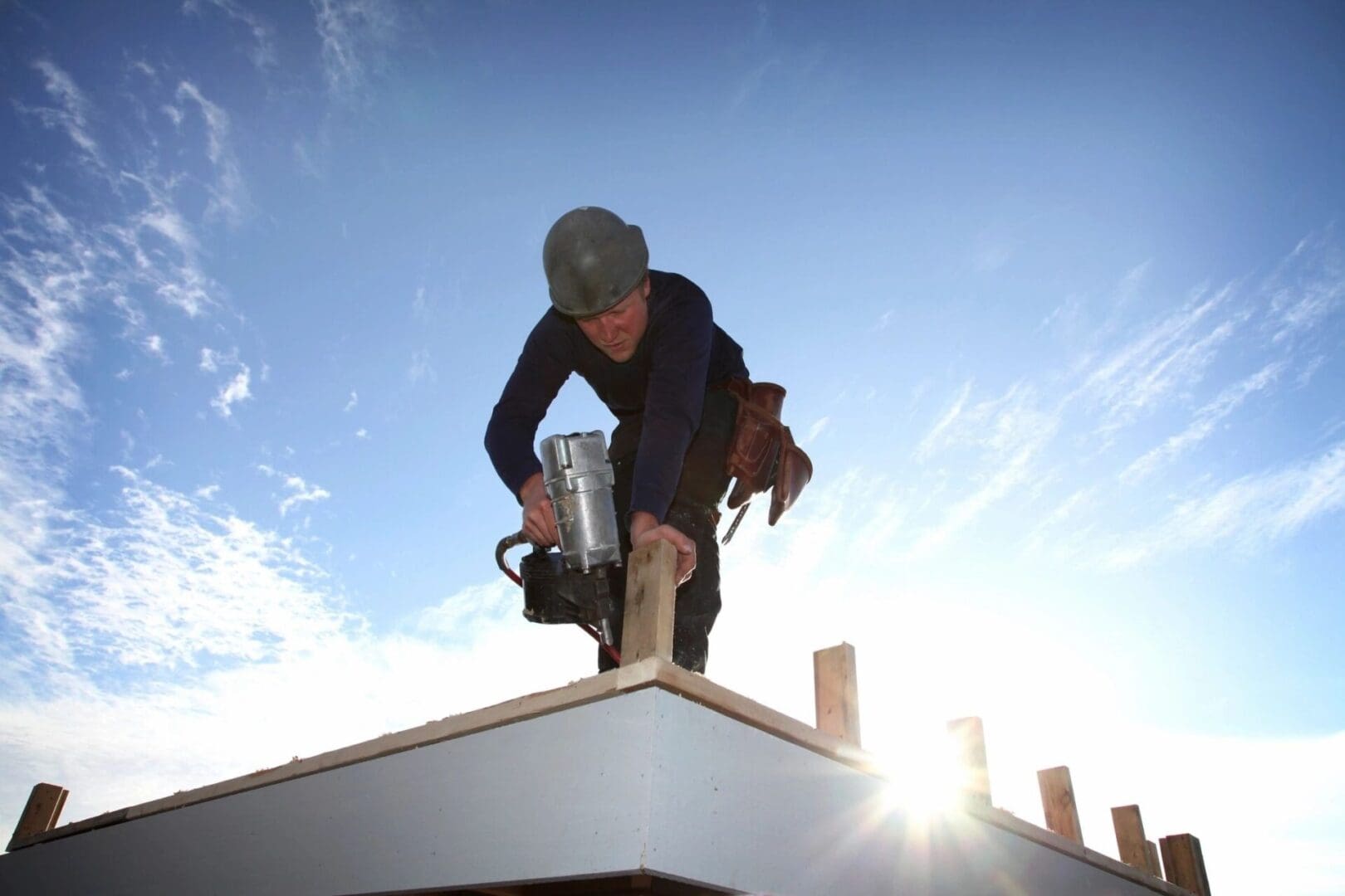 A man working on the roof of a building.